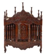 An 18th century French walnut panetiere, shaped pediment with turned finials,