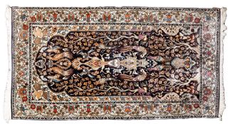 A Kashmir rug, the indigo mihrab with a design of birds amidst flowering stems,