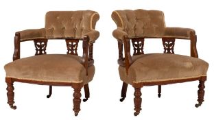 A pair of Edwardian walnut salon tub chairs,