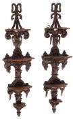 A pair of Rococo Revival style carved mahogany wall brackets,