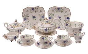 A Staffordshire porcelain part tea service, comprising a teapot, cover and stand, milk jug,