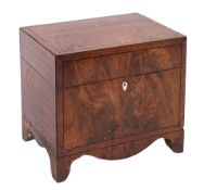 A George IV mahogany box decanter, of rectangular form, decorated with ebony stringing,