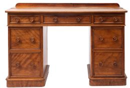 A Victorian maple pedestal desk, in George III style,