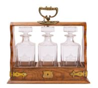 An oak and brass mounted tantalus,