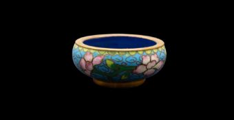 A group of thirteen items of Chinese and Japanese cloisonne variously decorated with flowers,
