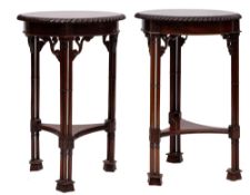 A pair of mahogany circular occasional tables in Chippendale taste,