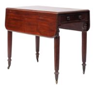 A Regency mahogany Pembroke table, early 19th century; the twin drop leaves with rounded corners,