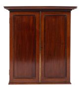 An early 19th Century mahogany estate cabinet with a moulded cornice,