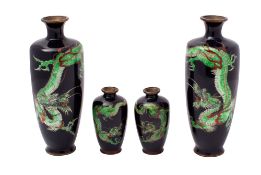 A pair of Japanese cloisonne vases and a matching smaller pair all decorated with a sinuous scaly