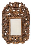 A carved and polychrome oak framed wall mirror in Charles II style,