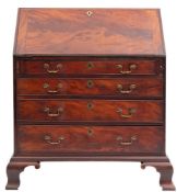A George III mahogany bureau, circa 1765; the hinged fall front opening to a fitted interior,