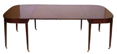 A mahogany extending dining table in George III style,
