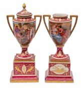 A pair of Austrian Vienna-style porcelain two-handled urns and one cover each decorated with