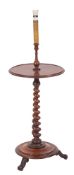 A Victorian mahogany circular lamp table, adapted for electric light,