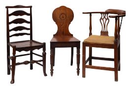 A George III oak corner elbow chair,