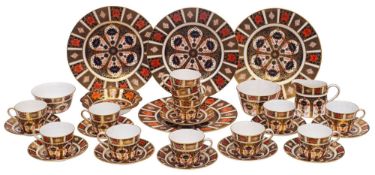 A Royal Crown Derby Old Imari tea service, comprising;- twelve cups, ten saucers, two sugar bowls,