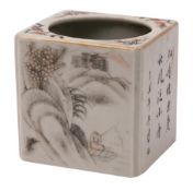 A Chinese square-section brush pot enamelled in iron-red and en grisaille with landscapes and