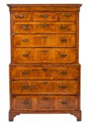 An early 18th Century walnut veneer and oak chest on chest,
