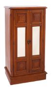 An Edwardian mahogany music cabinet,