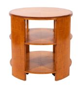 A maple and crossbanded circular library occasional table in Art Deco taste;