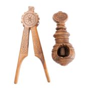 Two carved treen nutcrackers, comprising a Continental chip carved example, early 19th century,