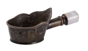 A Chinese jade-handled bronze silk iron cast with shou medallions on a diaper ground, 21cm.