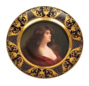 A Volkstedt porcelain cabinet plate painted in the Vienna manner with the portrait of a semi-nude
