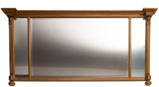 A gold painted wood and composition overmantel mirror in Regency style,