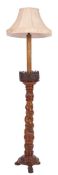 A Continental carved wood standard lamp,
