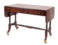 A Regency mahogany and inlaid sofa table, bordered with ebony lines,