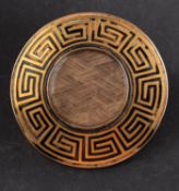 A Victorian mourning brooch, the central glazed compartment with hairwork,