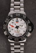 WITHDRAWN LOT Tag Heuer a gentleman's Formula 1 alarm wristwatch the silvered dial with subsidiary