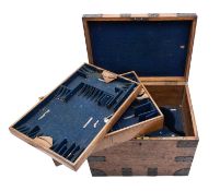 An early 19th century oak and metal bound silver canteen box, with brass plate engraved 'Mrs. P.F.