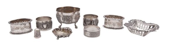 A pair of George V silver napkin rings, Birmingham 1910, a pair of Indian silver napkin rings,