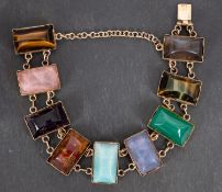 A cabochon-cut, vari-coloured gemset bracelet, including inter alia tiger's eye, rose quartz,