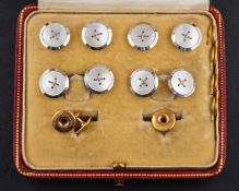 A mother-of-pearl dress stud set including a pair of cufflinks,