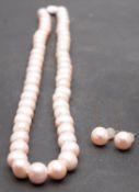 A single-row, cultured pearl necklace and pair of cultured button pearl ear studs,