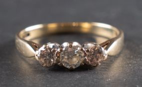 A 9ct gold, round, brilliant-cut diamond three-stone ring, total estimated diamond weight ca. 0.