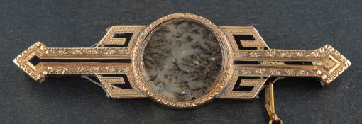 An early 20th century, dendretic quartz 'picture' brooch, with foliate engraving, total length ca.