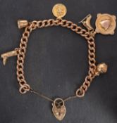 A 9ct gold, curb-link charm bracelet, with heart-shaped clasp,
