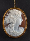 A shell cameo brooch, depicting Dionysius in profile, with ropetwist surround, total length ca. 5.