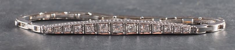 A graduated, single and round brilliant-cut diamond bracelet, total estimated diamond weight ca. 0.
