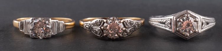 Three round, brilliant-cut diamond rings, including a ring marked '14K',