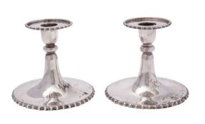 A pair of Edward VIII silver dressing table candlesticks, Elkington and Co, London,