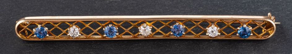 A old-cut diamond and round, mixed-cut, probably synthetic sapphire, openwork brooch,