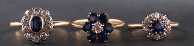Three diamond and sapphire cluster rings, including an 18ct gold ring, with diamond weight ca. 0.