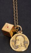 An 18ct gold medallion depicting Jesus Christ,