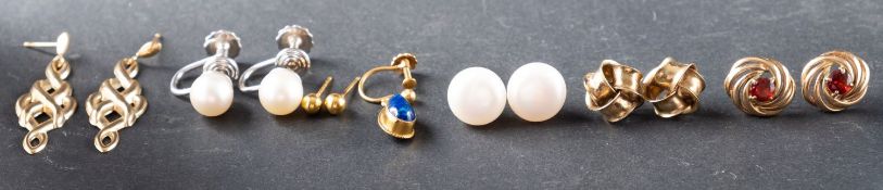 A small collection of earrings,