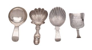 A small collection of early 19th century silver caddy spoons, to include a shell bowl,