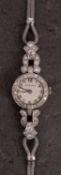 Noblex, a white-metal lady's cocktail watch, the dial with raised baton numerals and signed Noblex,